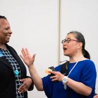 Women standing and talking